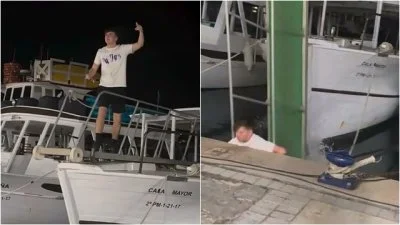 影／得意完下秒慘了！遊客挑戰爬船離開時失衡　「下巴撞水泥地」直墜落海影片瘋傳